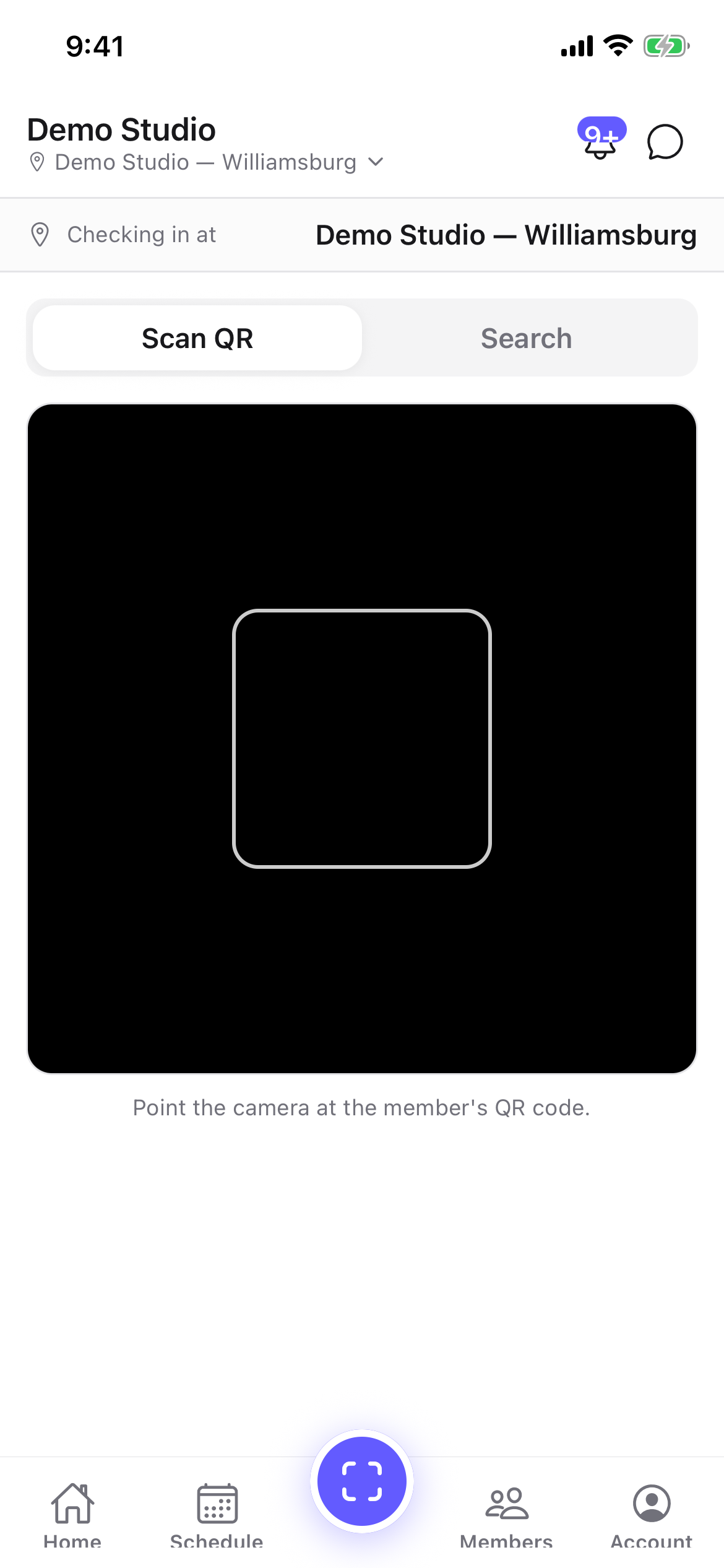 The mobile check-in scanner with Scan QR and Search tabs